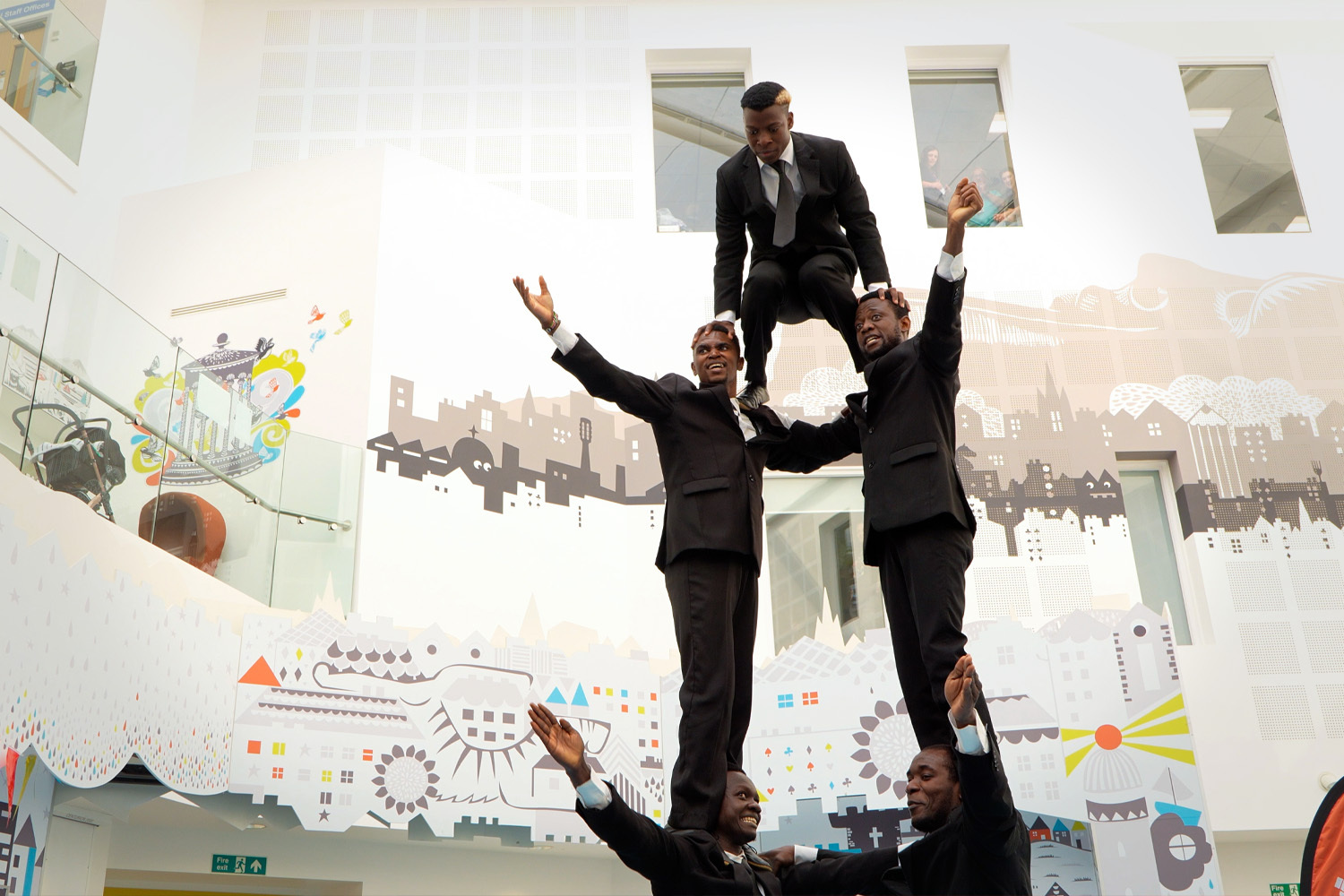 A human pyramid of Fringe acrobats performing at the Edinburgh Children's Hospital.